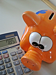 Orange Piggy Bank And Calculator